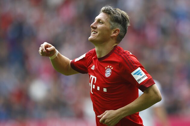 Bayern's Bastian Schweinsteiger celebrates after scoring his side's second goal during the German first division Bundesliga soccer match between FC Bayern Munich and 1. FSV Mainz 05 at the Allianz Arena in Munich, Germany, on Saturday, May 23, 2015. (AP Photo/Matthias Schrader)