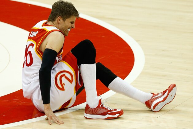 ATLANTA, GA - MAY 22:  Guard Kyle Korver #26 of the Atlanta Hawks falls to the court after injured his leg in Game Two of the Eastern Conference Finals against the Cleveland Cavaliers during the 2015 NBA Playoffs at Philips Arena on May 22, 2015 in Atlanta, Georgia.  NOTE TO USER: User expressly acknowledges and agrees that, by downloading and or using this photograph, user is consenting to the terms and conditions of the Getty Images Licensing Agreement.  (Photo by Mike Zarrilli/Getty Images)