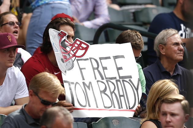 fans hold up a sign in the first inning during a baseball game between the Arizona Diamondbacks and the Washington Nationals, Wednesday, May 13, 2015, in Phoenix. (AP Photo/Rick Scuteri)