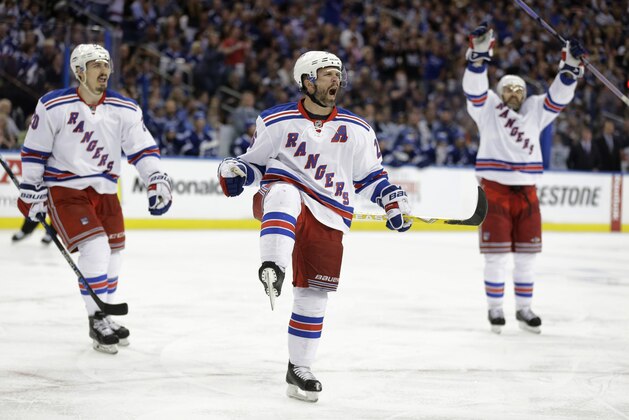 New York Rangers right wing Martin St. Louis, center, celebrates after scoring a goal during the third period of Game 4 of the Eastern Conference finals against the Tampa Bay Lightning, in the NHL hockey Stanley Cup playoffs, Friday, May 22, 2015, in Tampa, Fla. (AP Photo/Chris O'Meara)