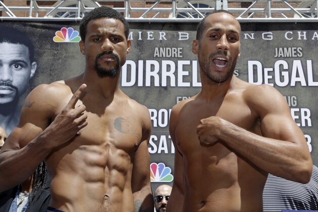 Boxer James DeGale, of England, right, and opponent Andre Dirrell pose after the weigh-in at Faneuil Hall in Boston, Friday, May 22, 2015. DeGale faces Dirrell for the vacant IBF super middleweight title on Saturday in Boston. (AP Photo/Elise Amendola)