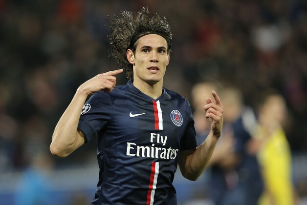 PSG's Edinson Cavani celebrates after scoring his side's first goal during the Champions League round of 16 first leg soccer match between Paris Saint Germain and Chelsea at the Parc des Princes stadium in Paris, France, Tuesday, Feb. 17, 2015. (AP Photo/Christophe Ena)