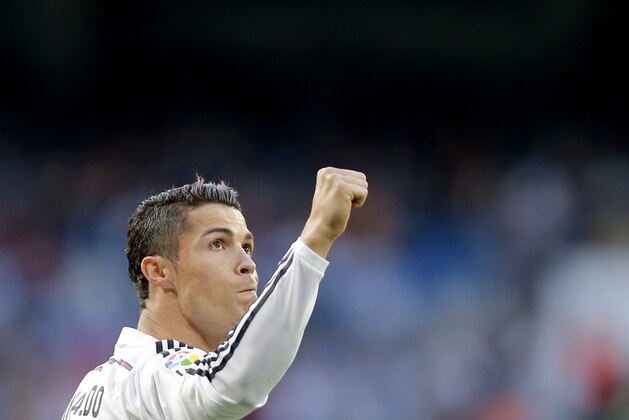 Real Madrid's Cristiano Ronaldo celebrates after scoring a goal during a Spanish La Liga soccer match between Real Madrid and Getafe at the Santiago Bernabeu stadium in Madrid, Spain, Saturday, May 23, 2015. (AP Photo/Daniel Ochoa de Olza)