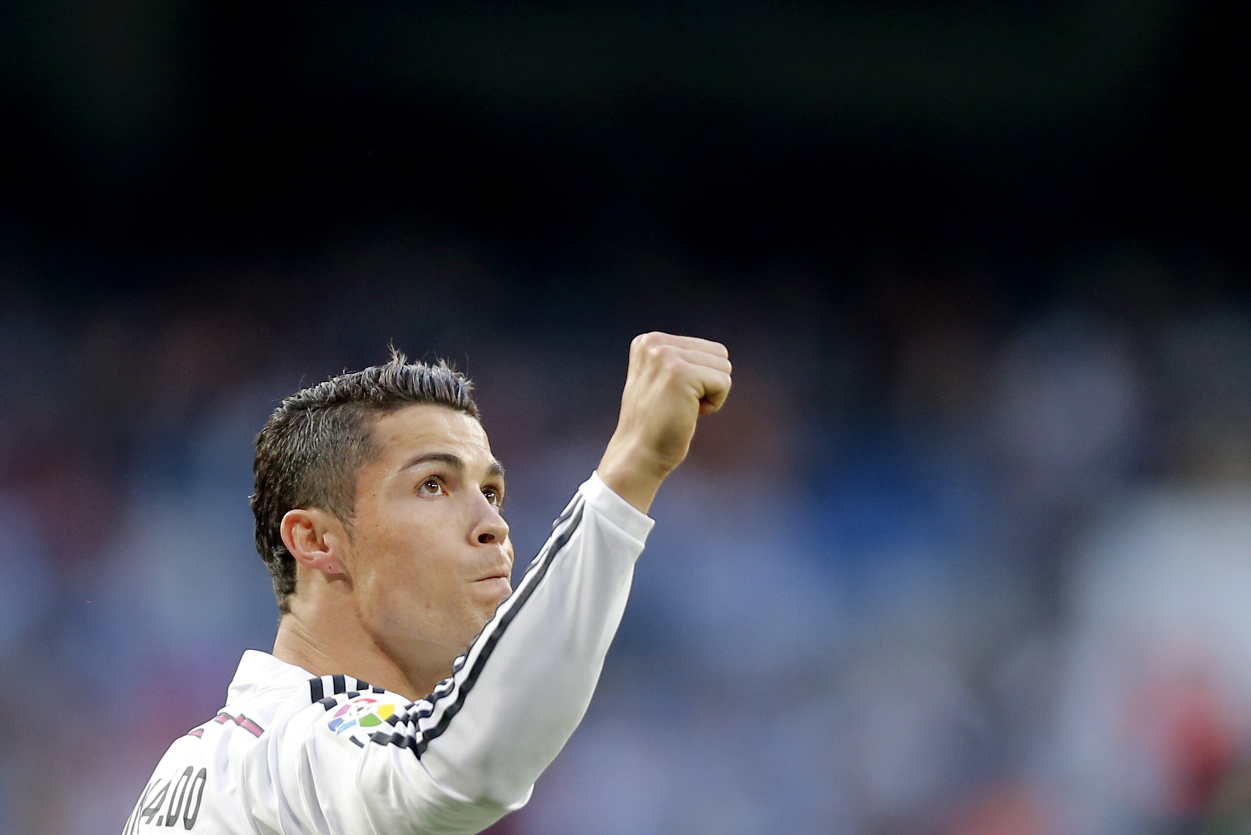 Real Madrid's Cristiano Ronaldo celebrates after scoring a goal during a Spanish La Liga soccer match between Real Madrid and Getafe at the Santiago Bernabeu stadium in Madrid, Spain, Saturday, May 23, 2015. (AP Photo/Daniel Ochoa de Olza)