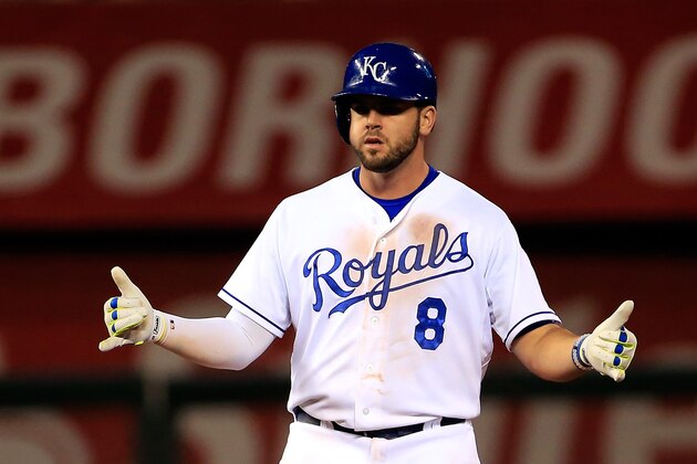 KANSAS CITY, MO - MAY 19:  Mike Moustakas #8 of the Kansas City Royals reacts after hitting a double to knock in a run during the 8th inning of the game against the Cincinnati Reds at Kauffman Stadium on May 19, 2015 in Kansas City, Missouri.  (Photo by Jamie Squire/Getty Images)