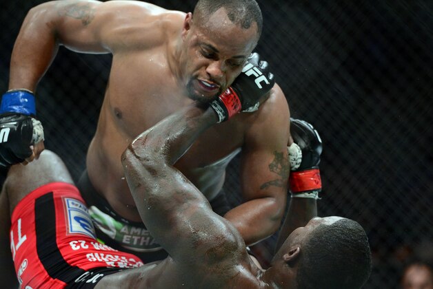 May 23, 2015; Las Vegas, NV, USA; Anthony Johnson (red gloves) and Daniel Cormier (blue gloves) fight during their light heavyweight championship bout during UFC 187 at MGM Grand Garden Arena. Cormier won via third round TKO. Mandatory Credit: Joe Camporeale-USA TODAY Sports