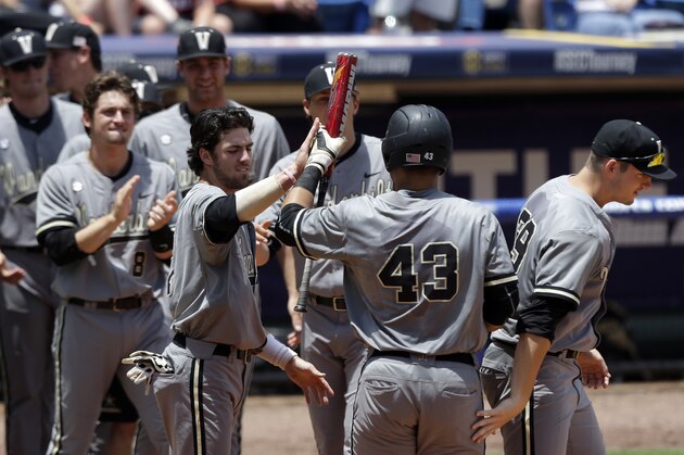 Vanderbilt’s Zander Wiel (43) celebrates with teammates after hitting a home run against Texas A&M during the third inning of an NCAA college baseball game in the Southeastern Conference tournament, Saturday, May 23, 2015, at the Hoover Met in Hoover, Ala. (AP Photo/Butch Dill)