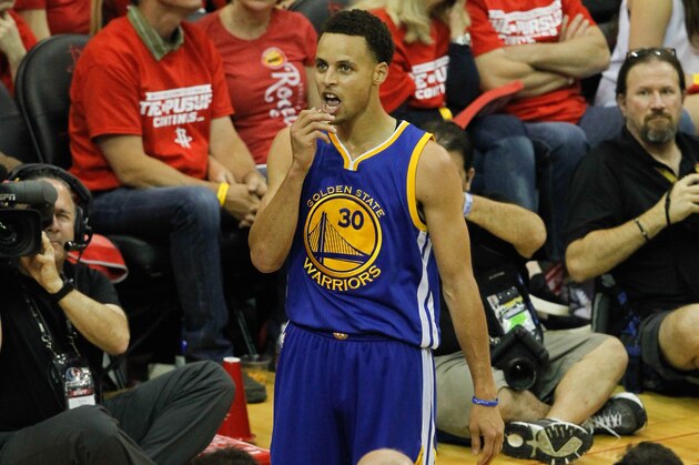 HOUSTON, TX - MAY 23:  Stephen Curry #30 of the Golden State Warriors pauses a moment to look at the crowd after hitting a three-point shot during Game Three of the Western Conference Finals at Toyota Center on May 23, 2015 in Houston, Texas.  NOTE TO USER: User expressly acknowledges and agrees that, by downloading and/or using this photograph, user is consenting to the terms and conditions of the Getty Images License Agreement.  (Photo by Bob Levey/Getty Images)