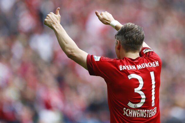 Bayern's Bastian Schweinsteiger celebrates after scoring his side's second goal during the German first division Bundesliga soccer match between FC Bayern Munich and 1. FSV Mainz 05 at the Allianz Arena in Munich, Germany, on Saturday, May 23, 2015. (AP Photo/Matthias Schrader)