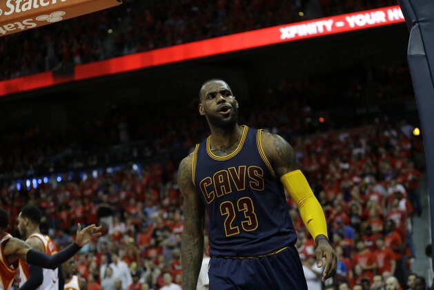 Cleveland Cavaliers forward LeBron James (23) reacts after making the basket and drawing a foul against the Atlanta Hawks during the second half in Game 2 of the Eastern Conference finals of the NBA basketball playoffs, Friday, May 22, 2015, in Atlanta. (AP Photo/David Goldman)