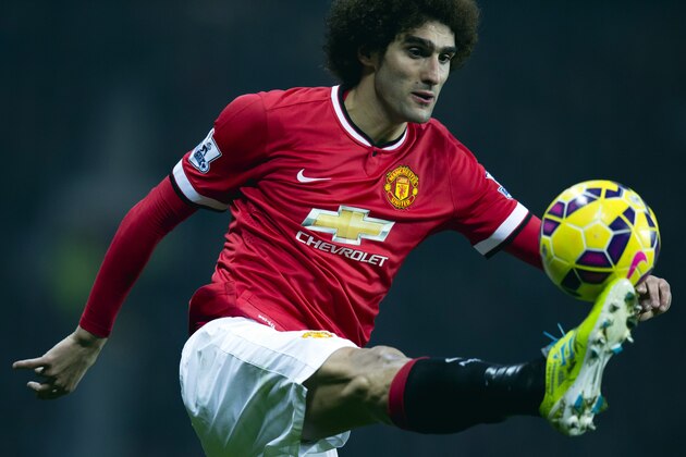 Manchester United's Marouane Fellaini controls the ball during the English Premier League soccer match between Manchester United and Hull City at Old Trafford Stadium, Manchester, England, Saturday Nov. 29, 2014. (AP Photo/Jon Super)