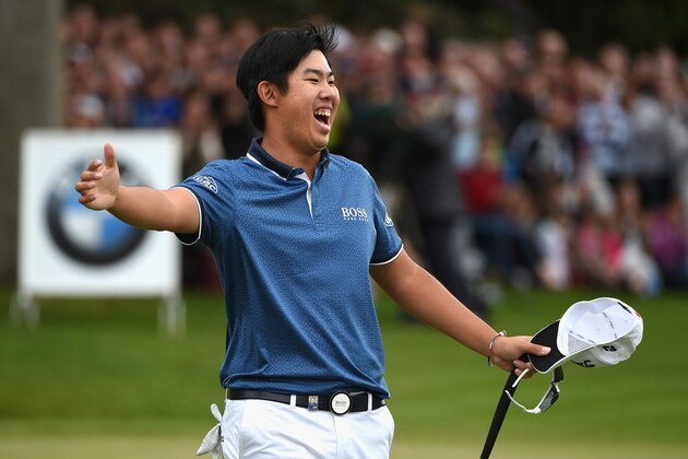 VIRGINIA WATER, ENGLAND - MAY 24:  Byeong-Hun An of South Korea celebrates victory on the 18th green during day 4 of the BMW PGA Championship at Wentworth on May 24, 2015 in Virginia Water, England.  (Photo by Ross Kinnaird/Getty Images)