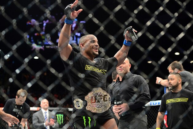 May 23, 2015; Las Vegas, NV, USA;  Daniel Cormier  celebrates after defeating Anthony Johnson (not pictured) in their light heavyweight championship bout during UFC 187 at MGM Grand Garden Arena. Cormier won via third round TKO. Mandatory Credit: Joe Camporeale-USA TODAY Sports