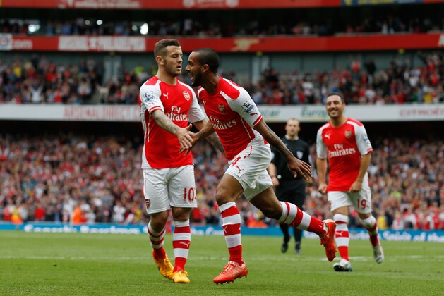 LONDON, ENGLAND - MAY 24:  Theo Walcott of Arsenal celebrates scoring his team's second goal during the Barclays Premier League match between Arsenal and West Bromwich Albion at Emirates Stadium on May 24, 2015 in London, England.  (Photo by Steve Bardens/Getty Images)