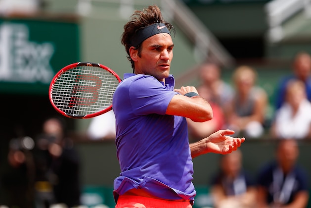 PARIS, FRANCE - MAY 24:  Roger Federer of Switzerland plays a forehand during his Men's Singles match against Alejandro Falla of Colombia on day one of the 2015 French Open at Roland Garros on May 24, 2015 in Paris, France.  (Photo by Julian Finney/Getty Images)
