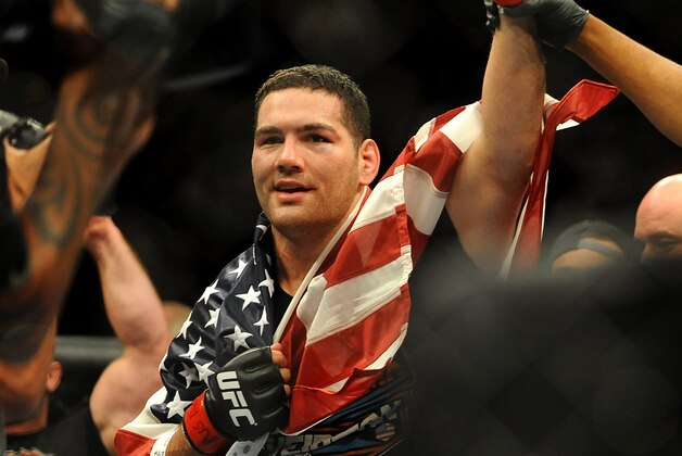 Jul 5, 2014; Las Vegas, NV, USA; Chris Weidman celebrates after successfully defending his middleweight title against Lyoto Machida at Mandalay Bay Events Center. Mandatory Credit: Stephen R. Sylvanie-USA TODAY Sports