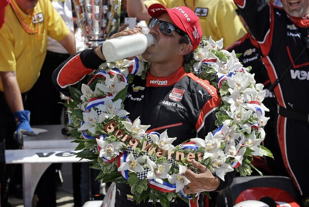 Juan Pablo Montoya, of Colombia, celebrates after winning the 99th running of the Indianapolis 500 auto race at Indianapolis Motor Speedway in Indianapolis, Sunday, May 24, 2015.  (AP Photo/Darron Cummings)