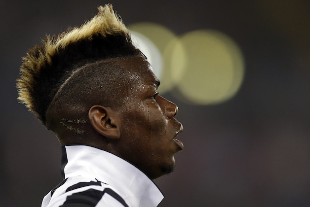 Juventus' Paul Pogba runs on the pitch during their Italian Cup soccer final match between Lazio and Juventus at Rome's Olympic stadium, Wednesday, May 20, 2015. (AP Photo/Gregorio Borgia)