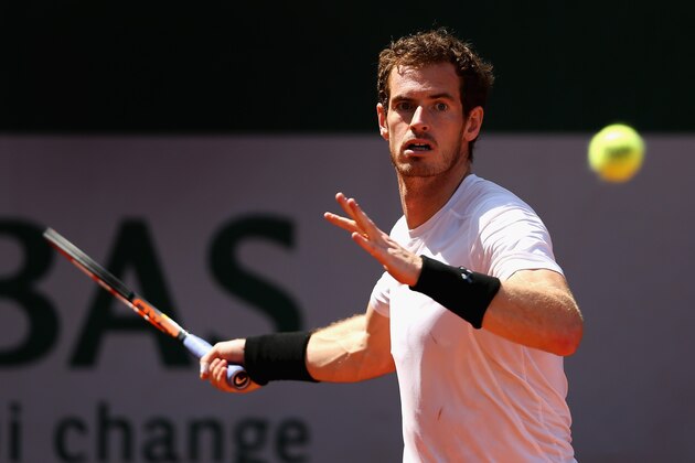PARIS, FRANCE - MAY 24:  Andy Murray of Great Britain plays a forehand as he warms up with Grigor Dimitrov of Bulgaria on day one of the 2015 French Open at Roland Garros on May 24, 2015 in Paris, France.  (Photo by Clive Brunskill/Getty Images)