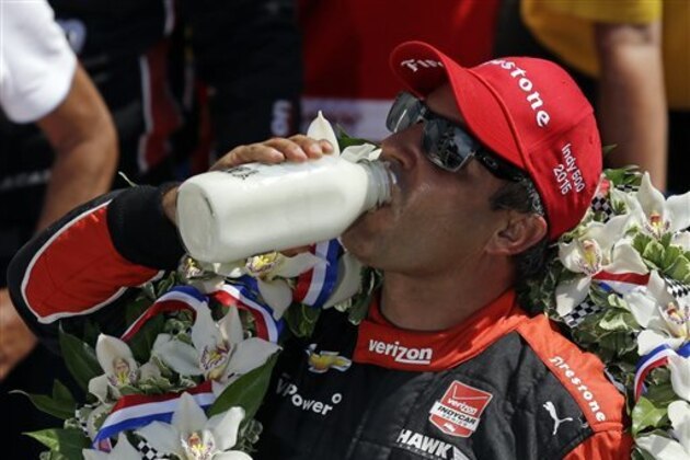 Juan Pablo Montoya, of Colombia, celebrates after winning the 99th running of the Indianapolis 500 auto race at Indianapolis Motor Speedway in Indianapolis, Sunday, May 24, 2015.  (AP Photo/Michael Conroy)