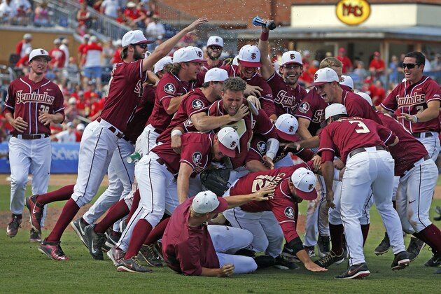 Florida State players celebrate their 6-2 win over North Carolina State after the Atlantic Coast Conference NCAA college baseball tournament championship game, Sunday, May 24, 2015, in Durham, N.C. (AP Photo/Karl B DeBlaker)