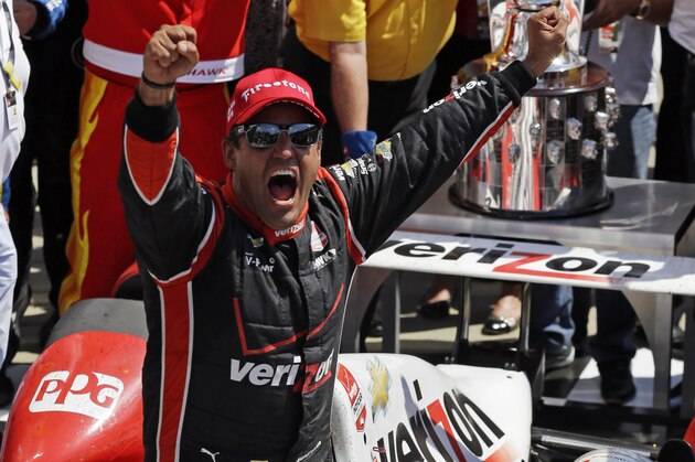 Juan Pablo Montoya, of Colombia, celebrates after winning the 99th running of the Indianapolis 500 auto race at Indianapolis Motor Speedway in Indianapolis, Sunday, May 24, 2015.  (AP Photo/Michael Conroy)