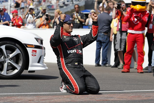 Juan Pablo Montoya, of Colombia, celebrates after winning the 99th running of the Indianapolis 500 auto race at Indianapolis Motor Speedway in Indianapolis, Sunday, May 24, 2015.  (AP Photo/Sam Riche)