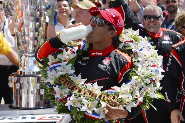 INDIANAPOLIS, IN - MAY 24:  Juan Pablo Montoya of Colombia driver of the #2 Team Penske Chevrolet Dallara celebrates after winning the 99th running of the Indianapolis 500 mile race by drinking milk at the Indianapolis Motor Speedway on May 24, 2015 in Indianapolis, Indiana.  (Photo by Robert Laberge/Getty Images)
