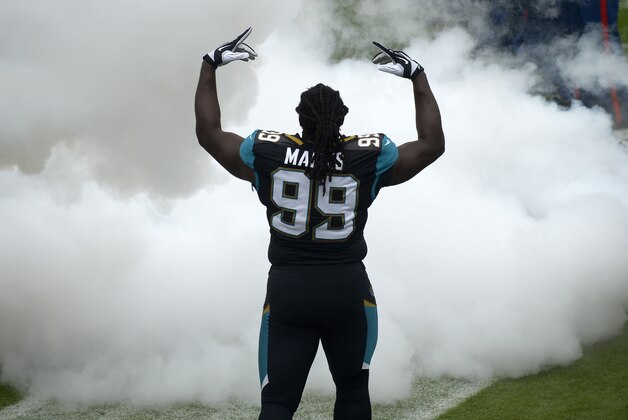 Jacksonville Jaguars defensive tackle Sen'Derrick Marks (99) prepares to run onto the field during player introductions prior to an NFL football game against the Arizona Cardinals in Jacksonville, Fla., Sunday, Nov. 17, 2013.(AP Photo/Phelan M. Ebenhack)