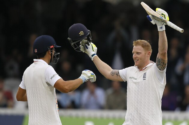 England's Ben Stokes, right, walks to captain Alastair Cook as he celebrates his century during the fourth day of the first Test match between England and New Zealand at Lord's cricket ground in London, Sunday, May 24, 2015. (AP Photo/Kirsty Wigglesworth)