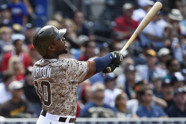 SAN DIEGO, CA - MAY 17:  Justin Upton #10 of the San Diego Padres hits a solo home run during the third inning of a baseball game against the Washington Nationals at Petco Park May 17, 2015 in San Diego, California.  (Photo by Denis Poroy/Getty Images)
