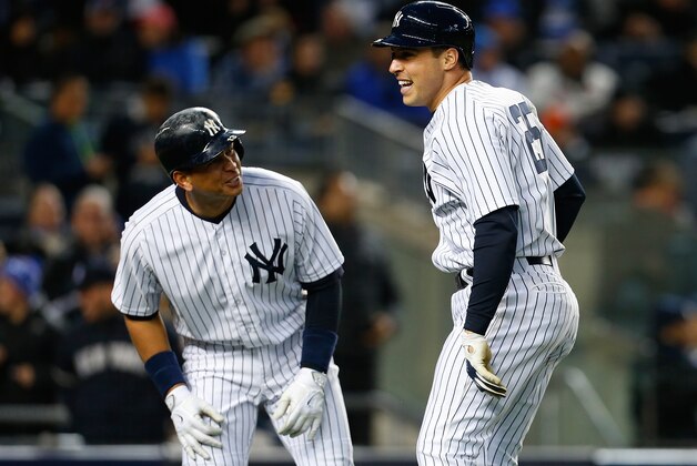 NEW YORK, NY - APRIL 24:  Mark Teixeira #25 of the New York Yankees (R) celebrates with teammate Alex Rodriguez #13 after hitting his second two run home run of the game in the third inning against the New York Mets on April 24, 2015  at Yankee Stadium in the Bronx borough of New York City.  (Photo by Mike Stobe/Getty Images)