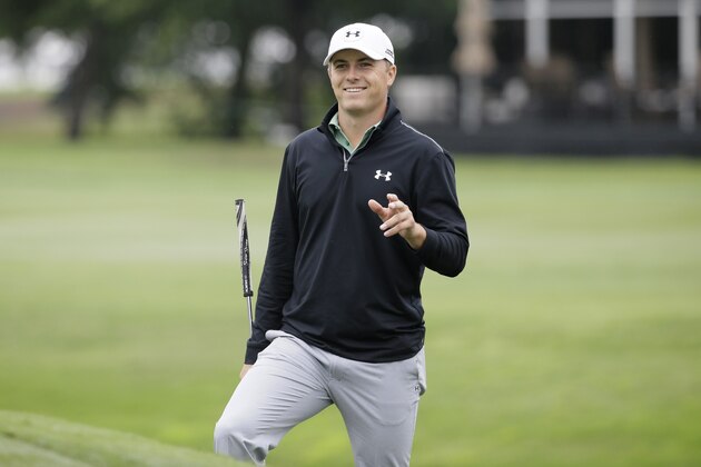 Jordan Spieth smiles as h3 waits to putt on the 18th hole during the second round of the Colonial golf tournament, Friday, May 22, 2015, in Fort Worth, Texas. (AP Photo/LM Otero)