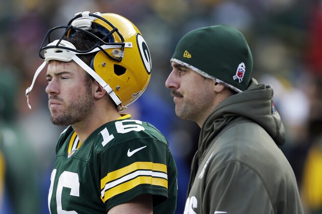 Green Bay Packers' Aaron Rodgers and Scott Tolzien watch from the sidelines during the second half of an NFL football game against the Philadelphia Eagles Sunday, Nov. 10, 2013, in Green Bay, Wis. The Eagles won 27-13. (AP Photo/Mike Roemer)