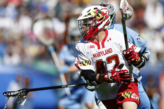 Maryland's Zack Wholley (42) moves the ball against Johns Hopkins during a semifinal match in the NCAA Division I men's lacrosse tournament, Saturday, May 23, 2015, Philadelphia. Maryland defeated Johns Hopkins 12-11. (AP Photo/Rich Schultz)