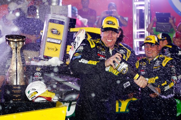 CHARLOTTE, NC - MAY 24:  Carl Edwards, driver of the #19 Subway Toyota, celebrates in Victory Lane after winning the NASCAR Sprint Cup Series Coca-Cola 600 at Charlotte Motor Speedway on May 24, 2015 in Charlotte, North Carolina.  (Photo by Jerry Markland/Getty Images)