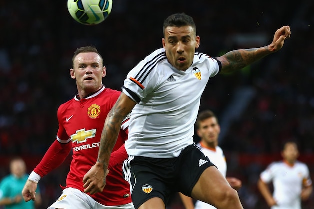 MANCHESTER, ENGLAND - AUGUST 12: Wayne Rooney of Manchester United in action with  Nicolas Otamendi of Valencia during the Pre Season Friendly match between Manchester United and Valencia at Old Trafford on August 12, 2014 in Manchester, England.  (Photo by Clive Brunskill/Getty Images)