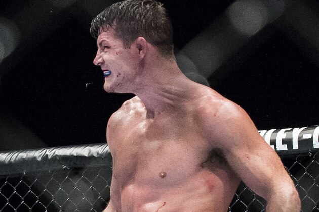 MACAU - AUGUST 23:   Michael Bisping of England celebrates after winning his middleweight fight against Cung Le of USA during the UFC Fight Night at The Venetian Macao Cotai Arena on August 23, 2014 in Macau, China.  (Photo by Victor Fraile/Getty Images)