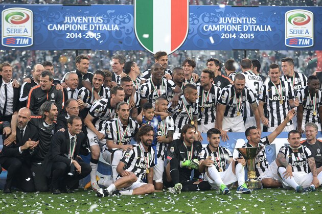 Juventus players celebrate at the end of a Serie A soccer match between Juventus and Napoli at the Juventus stadium, in Turin, Italy, Saturday, May 23, 2015. Juventus beat Napoli 3-1 in Serie A on Saturday as it celebrated winning the double of the Italian league and cup in a party atmosphere in Turin. (AP Photo/Massimo Pinca)