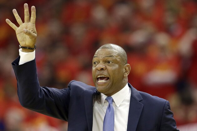 Los Angeles Clippers head coach Doc Rivers works the sideline against the Houston Rockets during the first half in Game 7 of the NBA basketball Western Conference semifinals Sunday, May 17, 2015, in Houston. (AP Photo/David J. Phillip)
