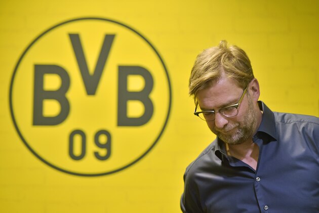 Borussia Dortmund's head coach Juergen Klopp leaves a press conference in the Dortmund stadium, Wednesday, April 15, 2015. Klopp will leave Borussia Dortmund at the end of this season after seven years in charge, stepping down after a dismal season for the soccer club. (AP Photo/Martin Meissner)