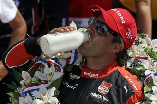 Juan Pablo Montoya, of Colombia, celebrates after winning the 99th running of the Indianapolis 500 auto race at Indianapolis Motor Speedway in Indianapolis, Sunday, May 24, 2015.  (AP Photo/Michael Conroy)