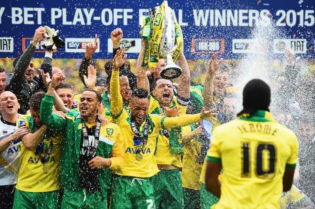 LONDON, ENGLAND - MAY 25:  Cameron Jerome of Norwich City (10) sprays his team mates with champagne in celebration after the Sky Bet Championship Playoff Final between Middlesbrough and Norwich City at Wembley Stadium on May 25, 2015 in London, England. Norwich City seal promotion to the Premier League with a 2-0 victory  (Photo by Laurence Griffiths/Getty Images)