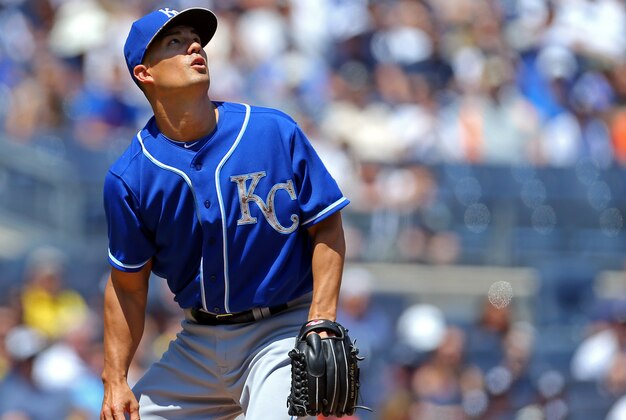 May 25, 2015; Bronx, NY, USA; Kansas City Royals starting pitcher Jeremy Guthrie (11) watches a two-run home run by New York Yankees third baseman Chase Headley (12) during the first inning at Yankee Stadium. Mandatory Credit: Adam Hunger-USA TODAY Sports