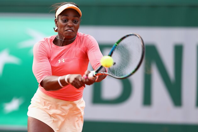 PARIS, FRANCE - MAY 25:  Sloane Stephens of the United States plays a backhand in her Women's Singles match against Venus Williams of the United States on day two of the 2015 French Open at Roland Garros on May 25, 2015 in Paris, France.  (Photo by Clive Brunskill/Getty Images)