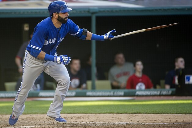 Toronto Blue Jays' Jose Bautista runs to first base, during a baseball game, in Cleveland, Saturday, May 2, 2015. (AP Photo/Phil Long)