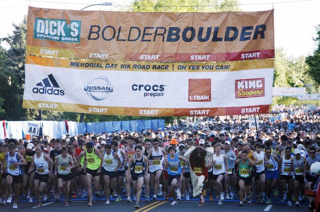 Runners break from the starting line for the 32nd annual running of the Bolder Boulder 10-kilometer road race through the streets of Boulder, Colo., on Monday, May 31, 2010. (AP Photo/David Zalubowski)