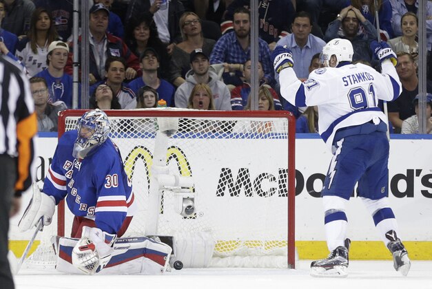 Tampa Bay Lightning center Steven Stamkos (91) reacts after scoring against New York Rangers goalie Henrik Lundqvist (30) during the second period of Game 5 of the Eastern Conference final during the NHL hockey Stanley Cup playoffs, Sunday, May 24, 2015, in New York. (AP Photo/Frank Franklin)