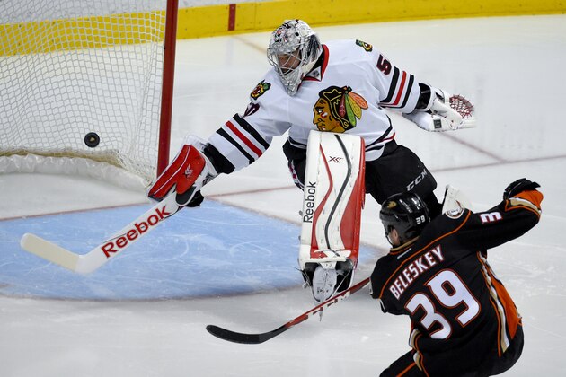 Anaheim Ducks left wing Matt Beleskey right, scores the game winning goal past Chicago Blackhawks goalie Corey Crawford during overtime in Game 5 of the Western Conference final of the NHL hockey Stanley Cup playoffs in Anaheim, Calif., on Monday, May 25, 2015. (AP Photo/Mark J. Terrill)
