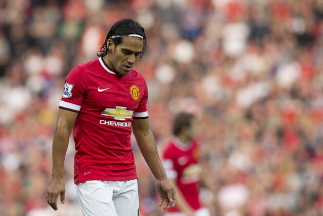 FILE - In this Sept. 14, 2014 file photo, Manchester United's Radamel Falcao Garcia walks on the field during his team's English Premier League soccer match at Old Trafford Stadium in Manchester, England. (AP Photo/Jon Super, File)